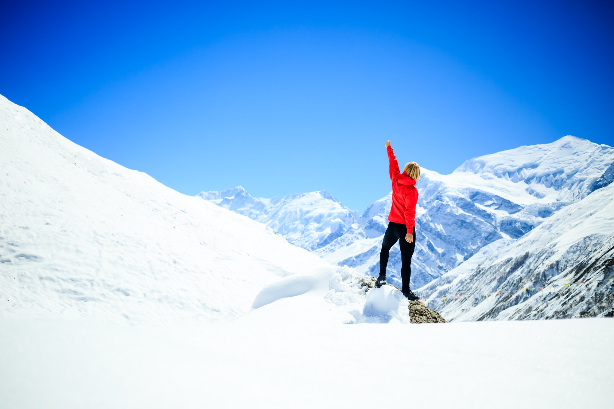Woman success climbing on mountain peak